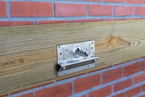 Ledger to the house or supporting structure connecting through brick or masonry veneer