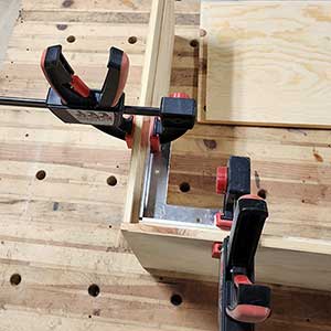 3-D Squares and clamps holding the corners square during assembly. 