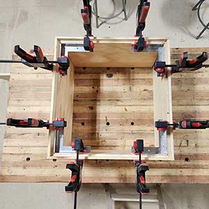 3-D Squares and clamps holding the corners square during assembly. All Four Corners are clamped.